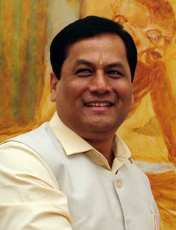Head-and-shoulders portrait of Sarbananda Sonowal, smiling, in a cream shirt and light Nehru jacket